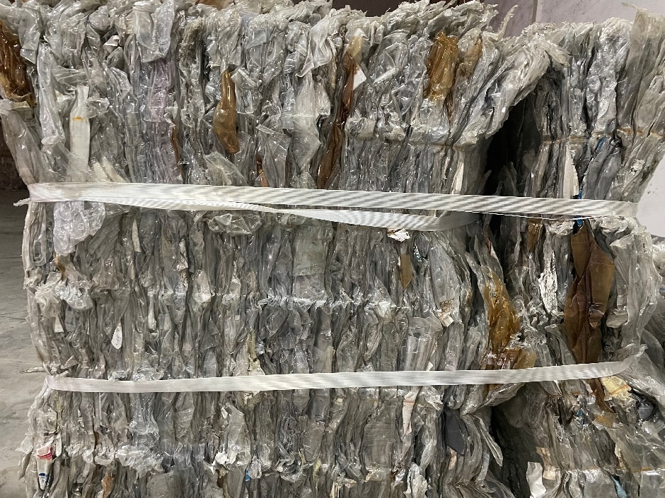 Baled post-consumer PET trays and thermoformed packaging compressed into dense blocks